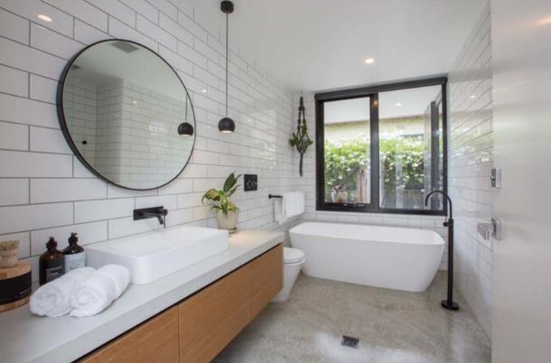 Renovated bathroom with freestanding bath and round mirror, Boxhill renovation Canterbury